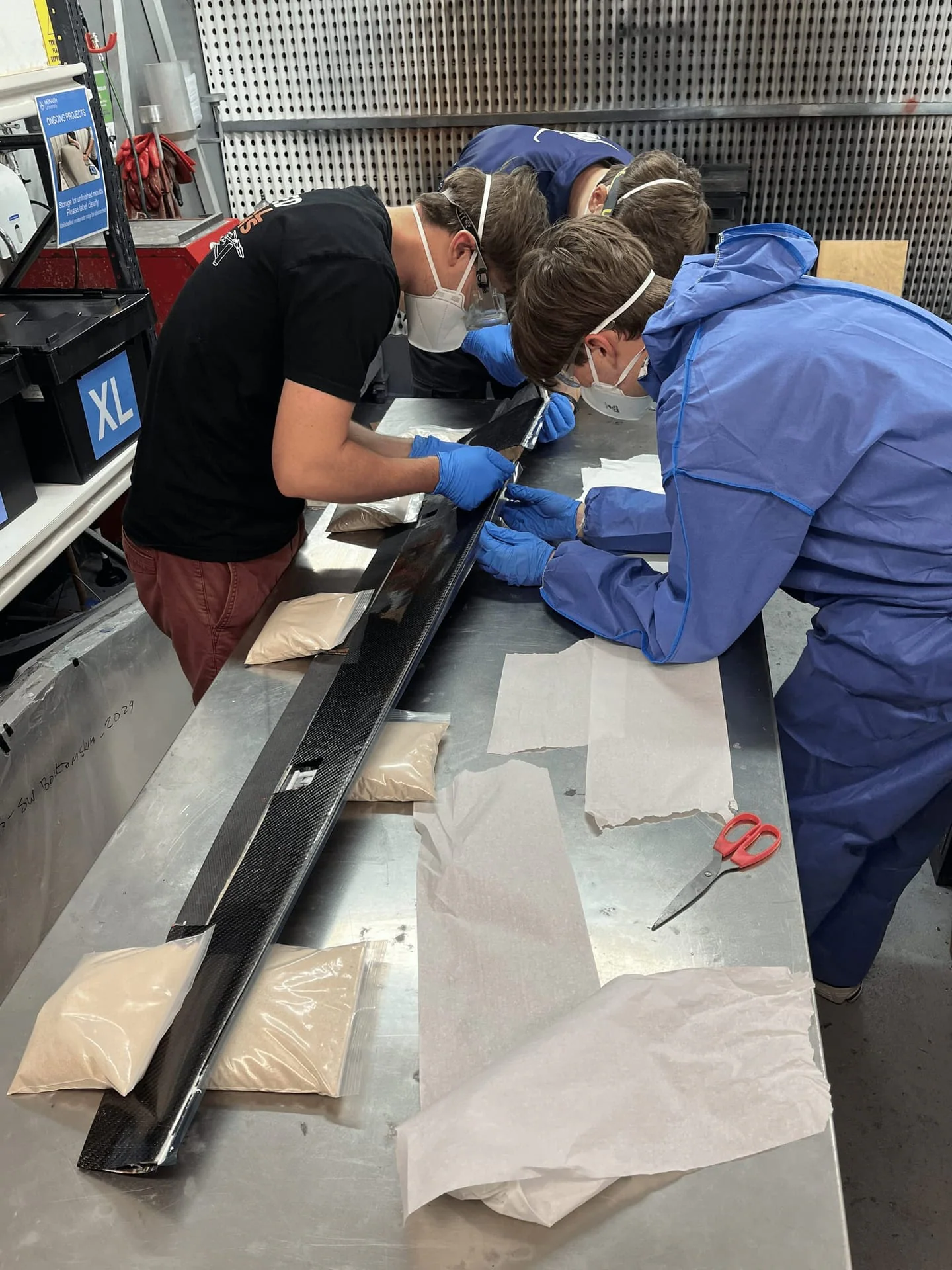 Aerostructures team work on aircraft hardware