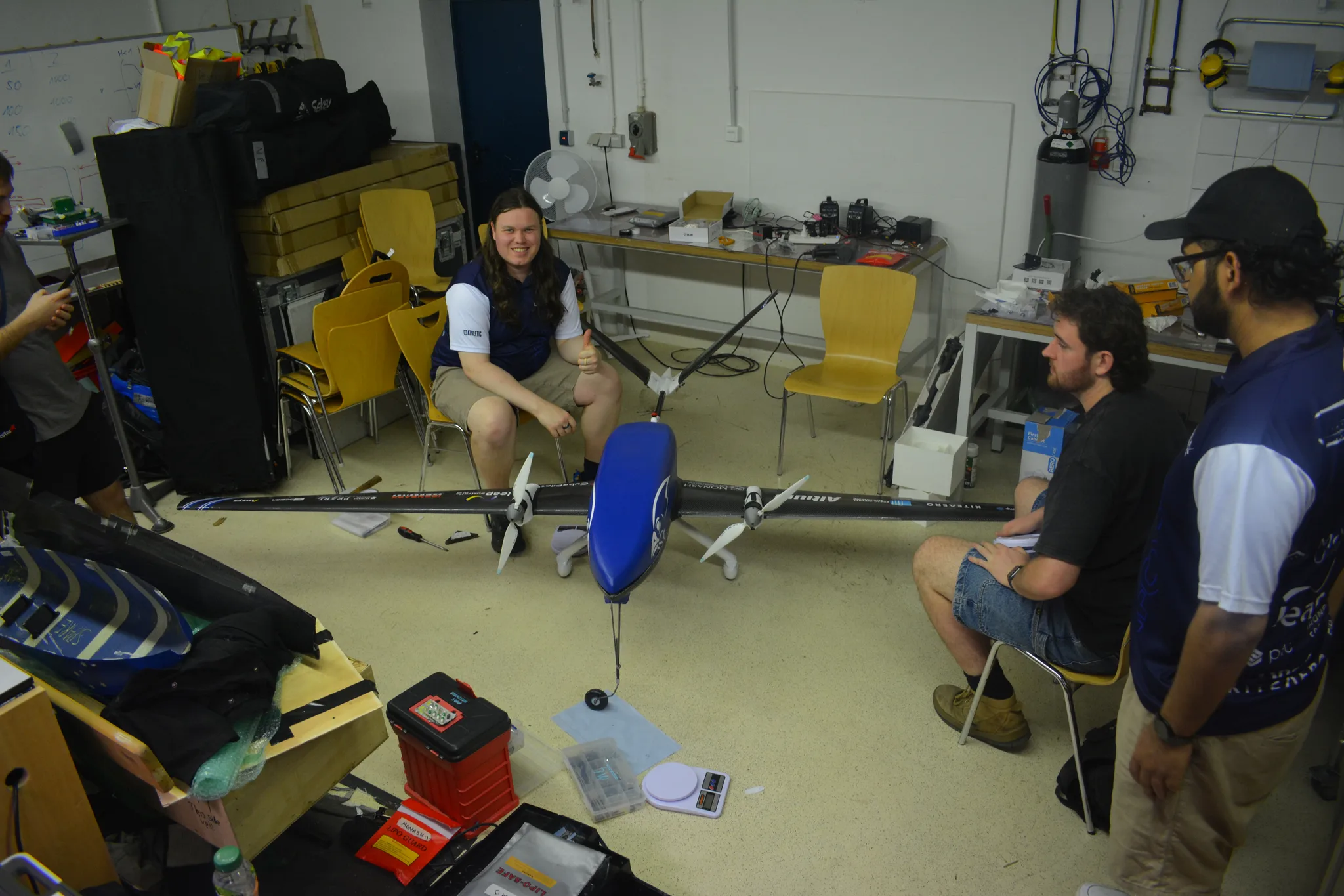 Team inspecting Peregrine Mk II in the workshop