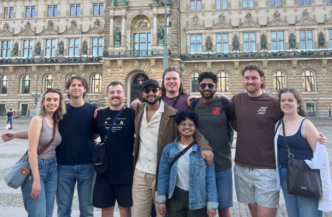 Team members travelling and celebrating after completing NFC 2025