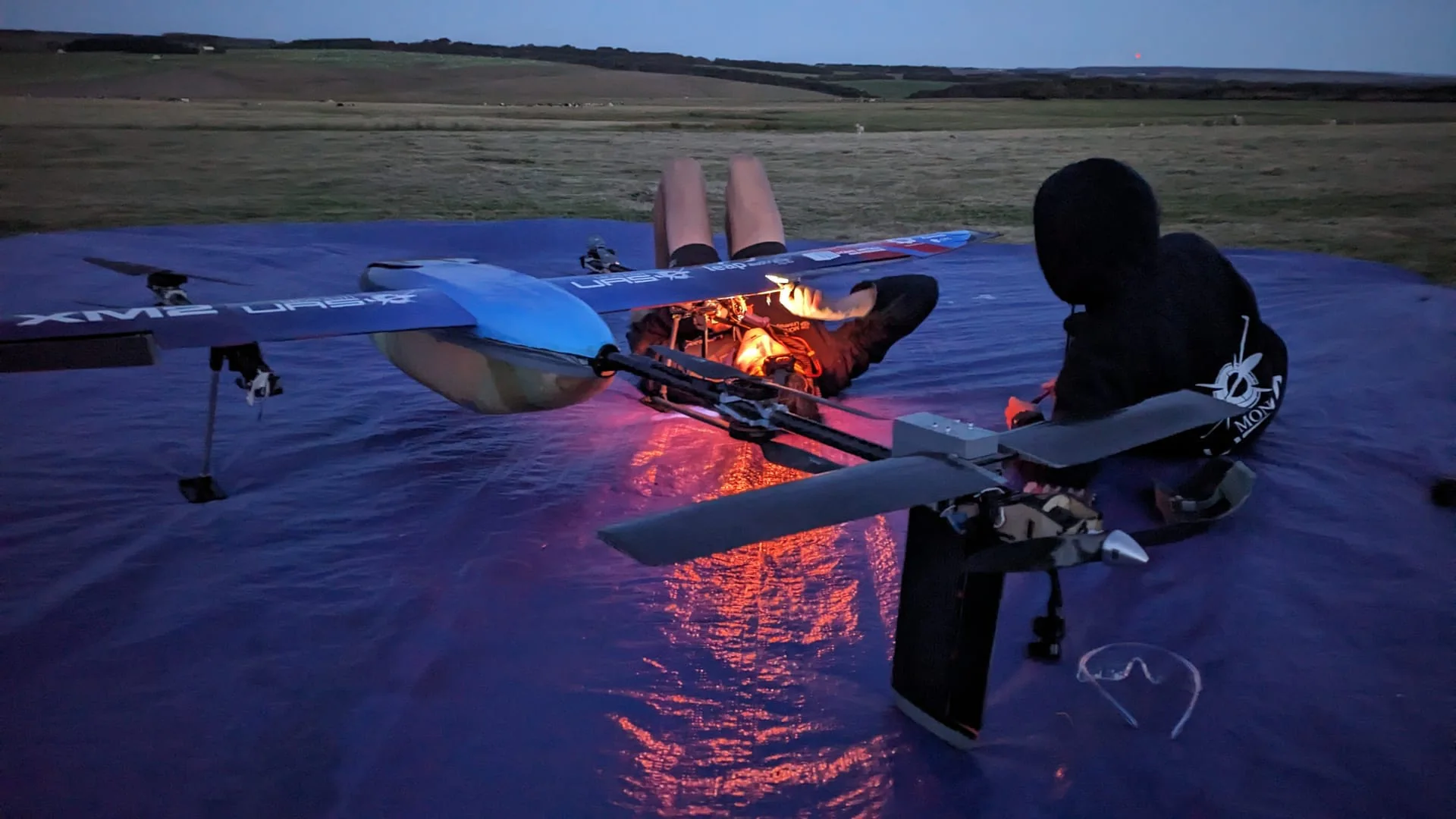 Flight Operations members working on Redback at dusk