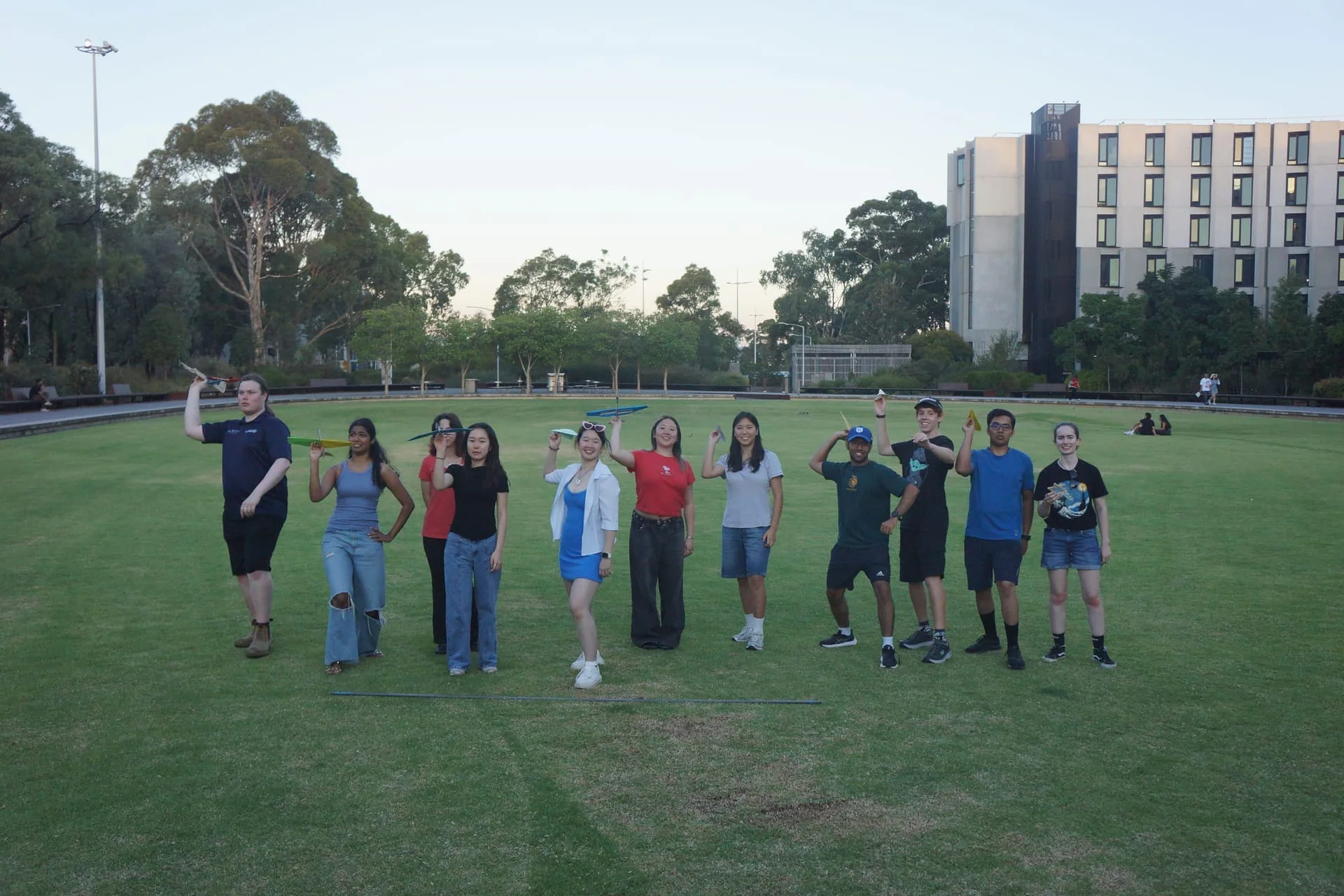 Operations members flying model aircraft on campus